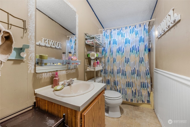 full bathroom with shower / bath combo, tile patterned flooring, a textured ceiling, toilet, and vanity