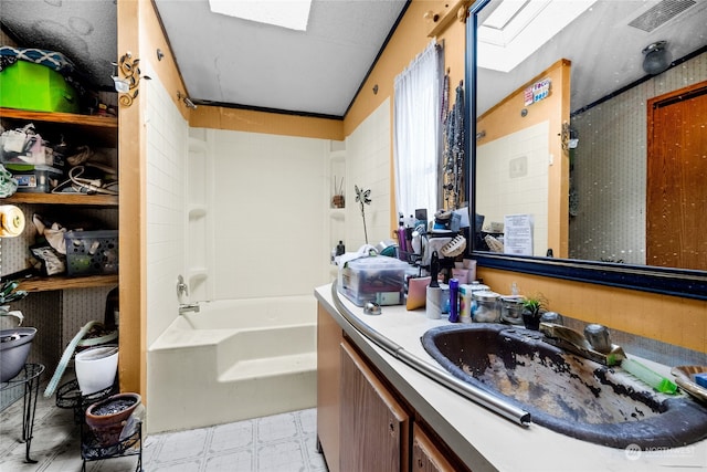 bathroom featuring vanity and shower / bathing tub combination