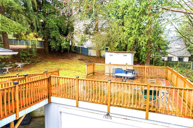 deck with a storage shed