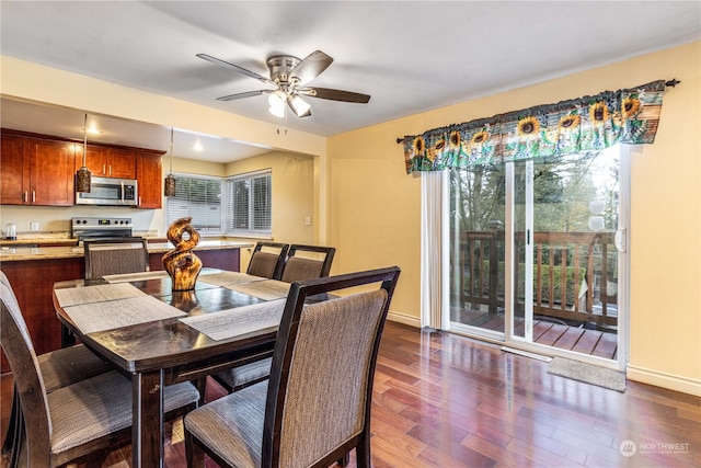 dining area with plenty of natural light, ceiling fan, and dark wood-type flooring