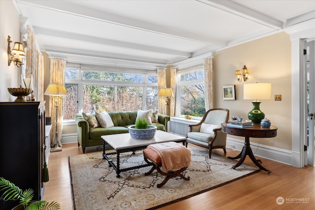 sunroom / solarium featuring beam ceiling