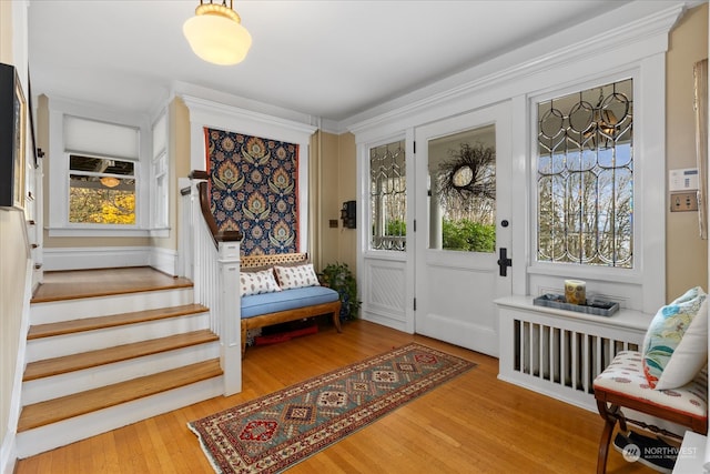 foyer entrance with hardwood / wood-style floors