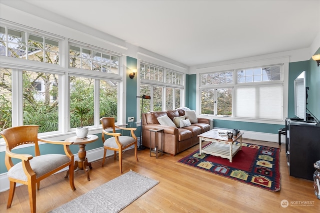 sunroom / solarium featuring a healthy amount of sunlight