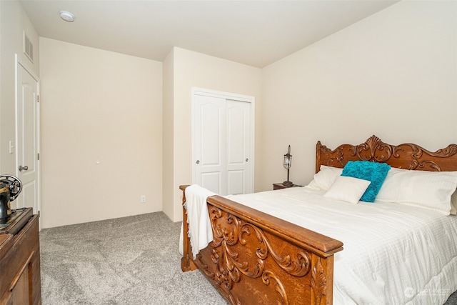 bedroom with a closet and light colored carpet