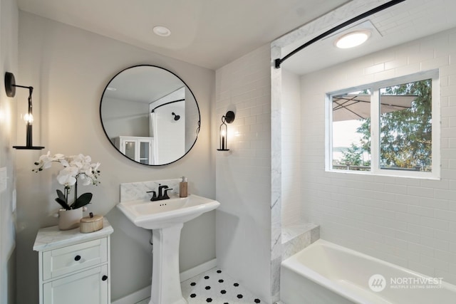 bathroom featuring tile patterned floors and a bathtub