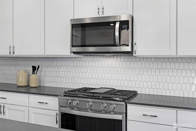 kitchen with white cabinets and appliances with stainless steel finishes