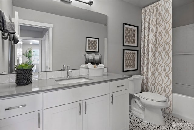 full bathroom with tile patterned floors, vanity, shower / tub combo, and toilet