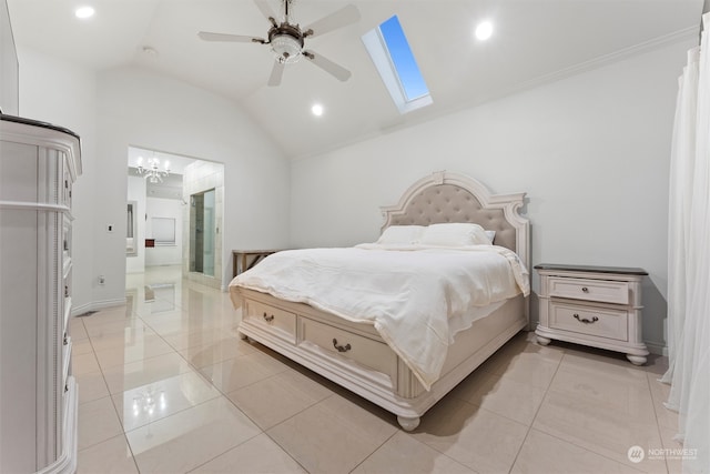 bedroom featuring light tile patterned floors, lofted ceiling with skylight, ensuite bath, and ceiling fan