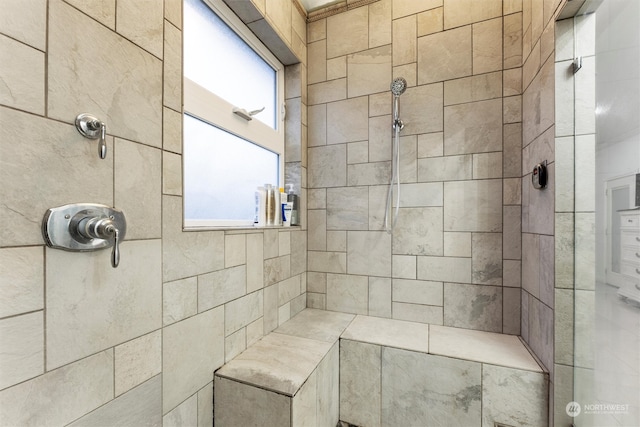 bathroom featuring tiled shower