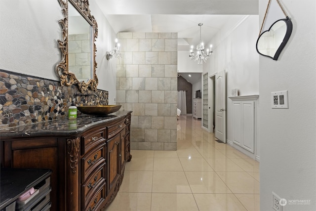 bathroom featuring tile patterned floors, crown molding, vanity, and tile walls