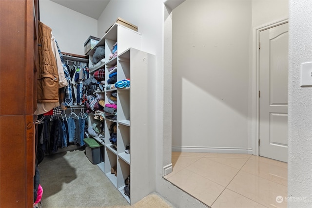 spacious closet featuring light tile patterned floors