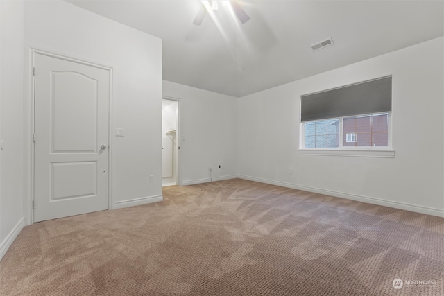 unfurnished room with ceiling fan and light colored carpet