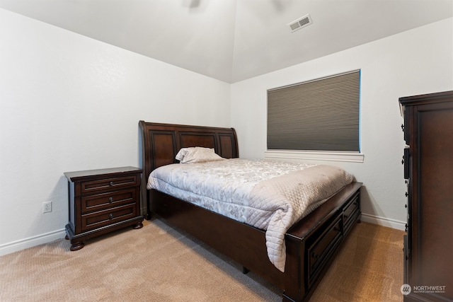 bedroom featuring light carpet