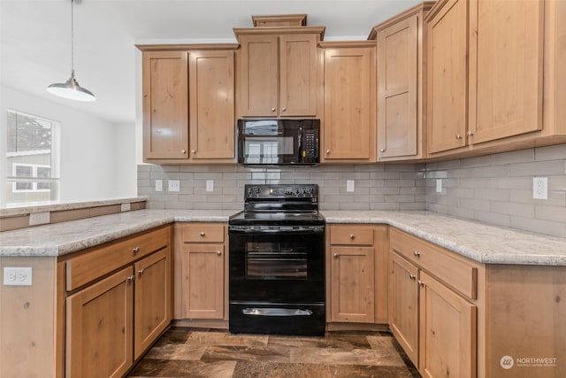 kitchen featuring black appliances, decorative backsplash, pendant lighting, and light stone counters