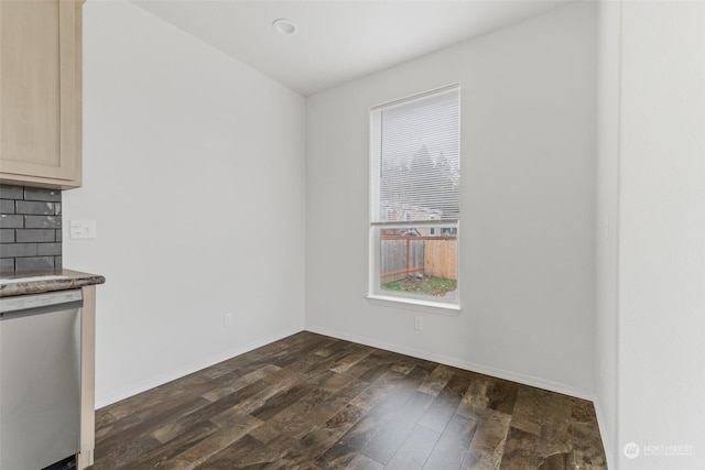 unfurnished dining area with dark hardwood / wood-style flooring