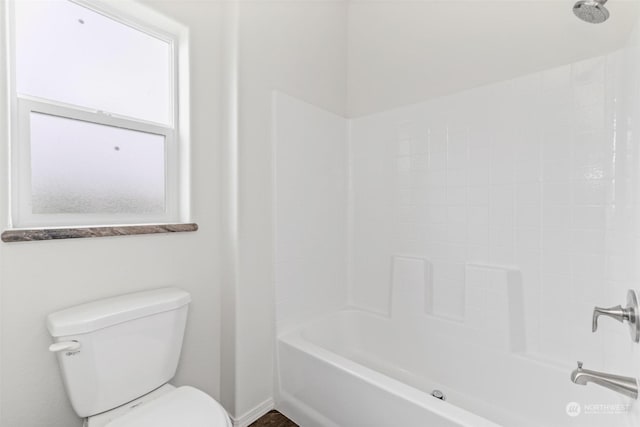 bathroom featuring shower / tub combination, toilet, and plenty of natural light