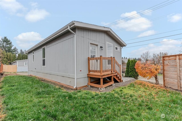 rear view of house with a lawn