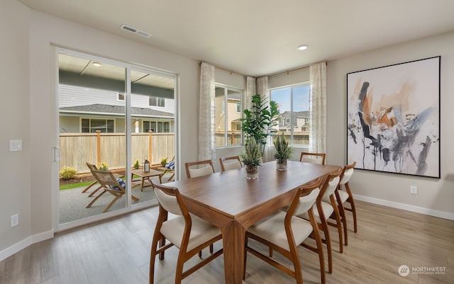 dining area with light wood-type flooring