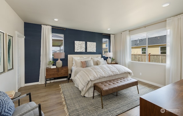 bedroom with hardwood / wood-style floors