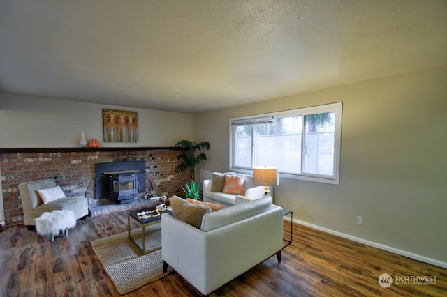 living room with dark hardwood / wood-style floors and a wood stove