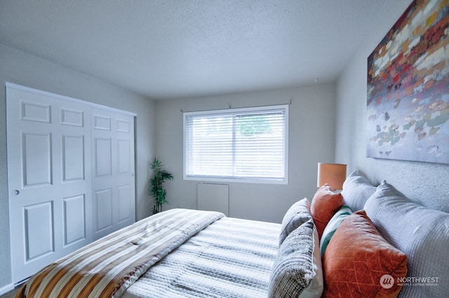 bedroom featuring a textured ceiling