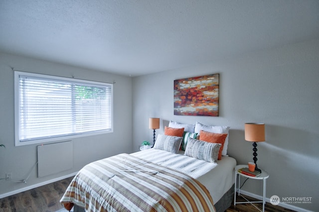 bedroom featuring dark hardwood / wood-style floors