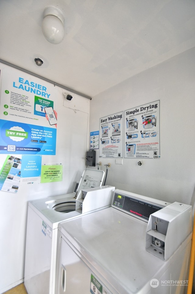 laundry room featuring washing machine and dryer