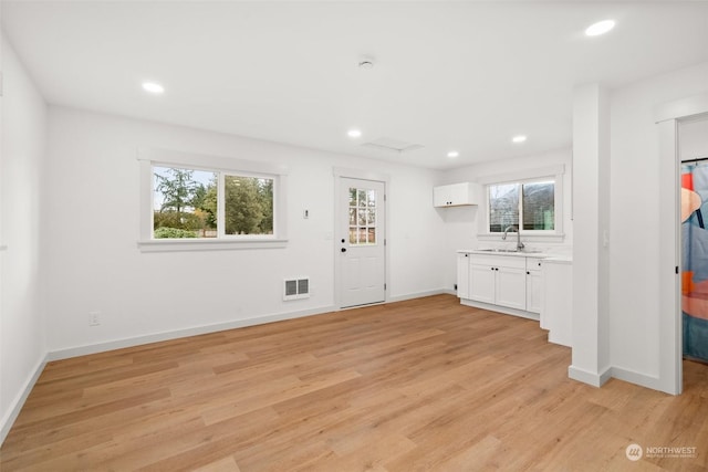 interior space featuring light hardwood / wood-style flooring and sink