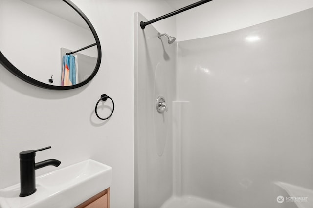 bathroom with vanity and walk in shower