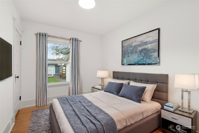 bedroom with light hardwood / wood-style floors