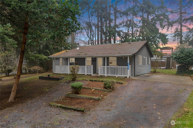 ranch-style house featuring a porch