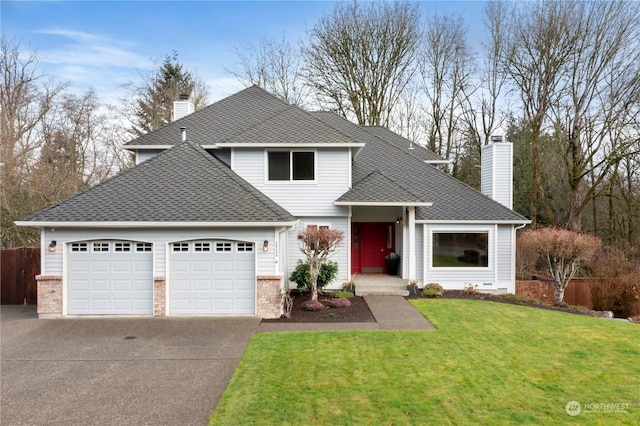 front of property with a garage and a front lawn