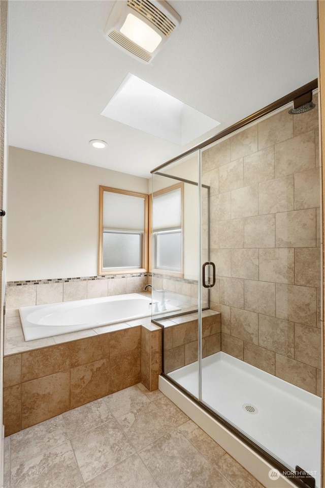 bathroom featuring tile patterned flooring and independent shower and bath