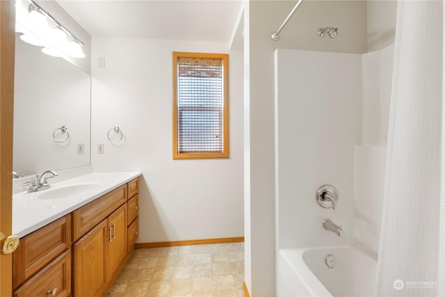 bathroom with shower / tub combo and vanity