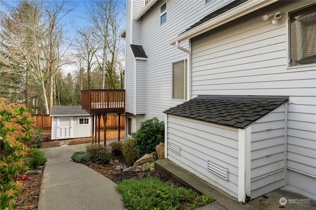 view of property exterior featuring a storage unit