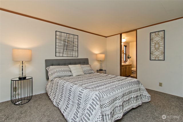 bedroom featuring carpet floors, ornamental molding, and connected bathroom