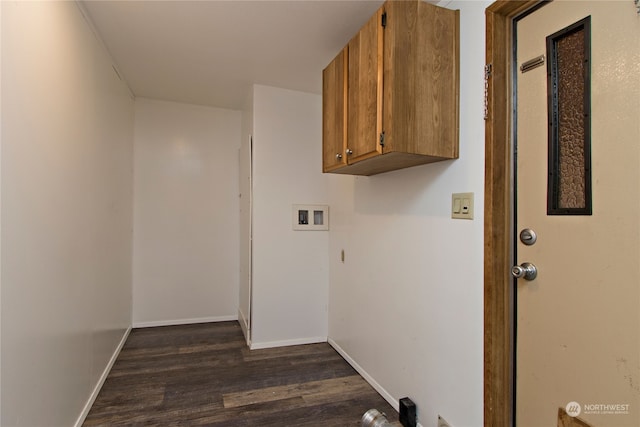 laundry room with washer hookup, dark hardwood / wood-style flooring, and cabinets