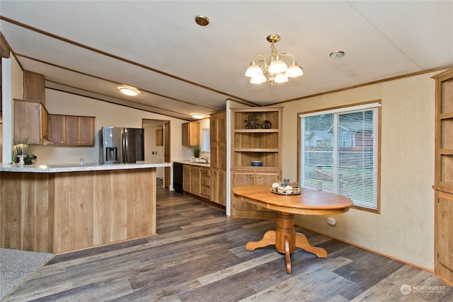 kitchen with kitchen peninsula, stainless steel fridge with ice dispenser, dark wood-type flooring, and lofted ceiling