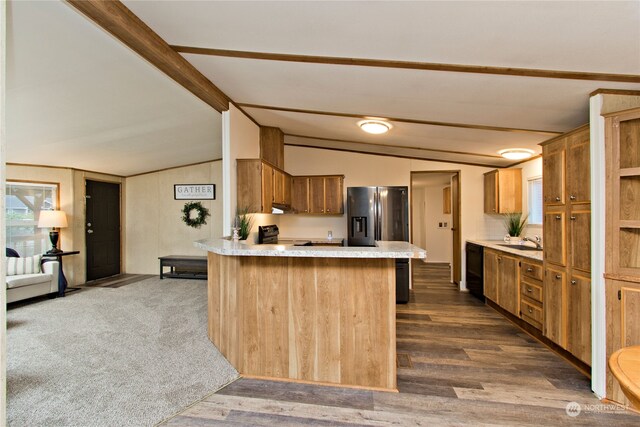 kitchen featuring sink, dark wood-type flooring, lofted ceiling with beams, range with electric stovetop, and kitchen peninsula