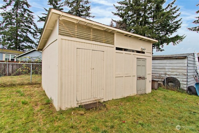 view of outdoor structure with a yard