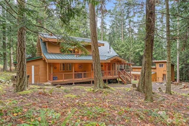 back of house with a porch