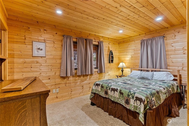 bedroom with light carpet, wooden ceiling, and wood walls