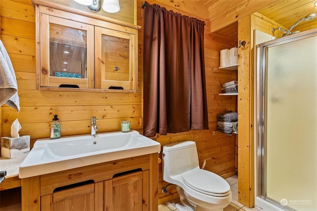 bathroom with vanity, toilet, walk in shower, and wooden walls