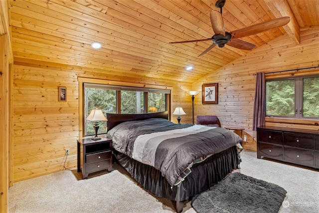 bedroom featuring multiple windows, wooden walls, ceiling fan, and wood ceiling