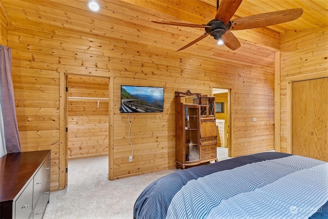 carpeted bedroom featuring ceiling fan, lofted ceiling with beams, wooden walls, a closet, and wood ceiling