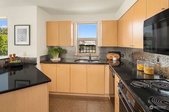 kitchen featuring light brown cabinetry, sink, and stainless steel appliances