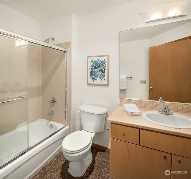 full bathroom with shower / bath combination with glass door, vanity, and toilet