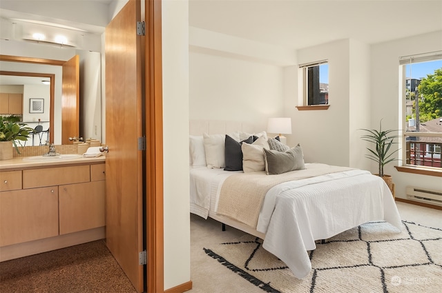 carpeted bedroom featuring sink