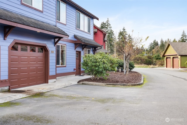 view of property exterior with a garage