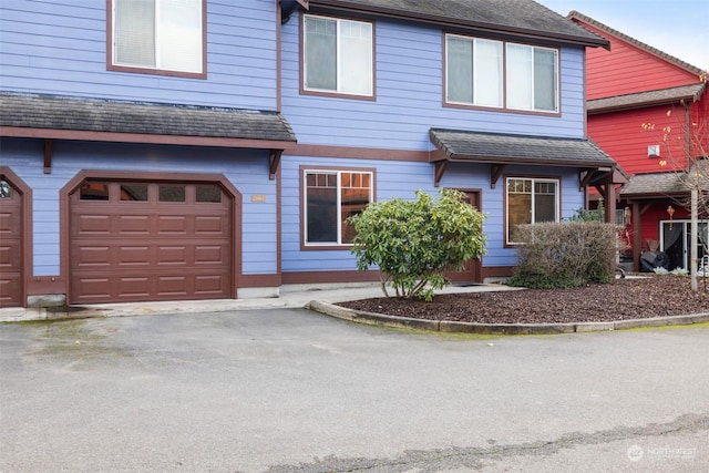 2606 Peach Ct Unit B, Port Angeles, WA 98363 - view of property with a garage and driveway